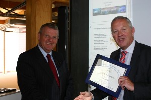 Rear Adm. Willem Voogt, RNLN (Ret.) (r), chapter president, presents a certificate of appreciation to Frans Copini, general director, International Security Experimentation and Transformation Institute (ISETI), for his presentation at the June meeting.